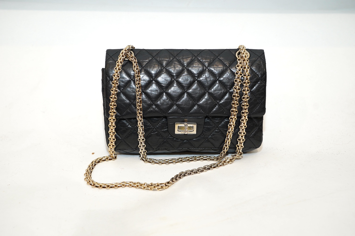 A Chanel 2.55 black leather handbag